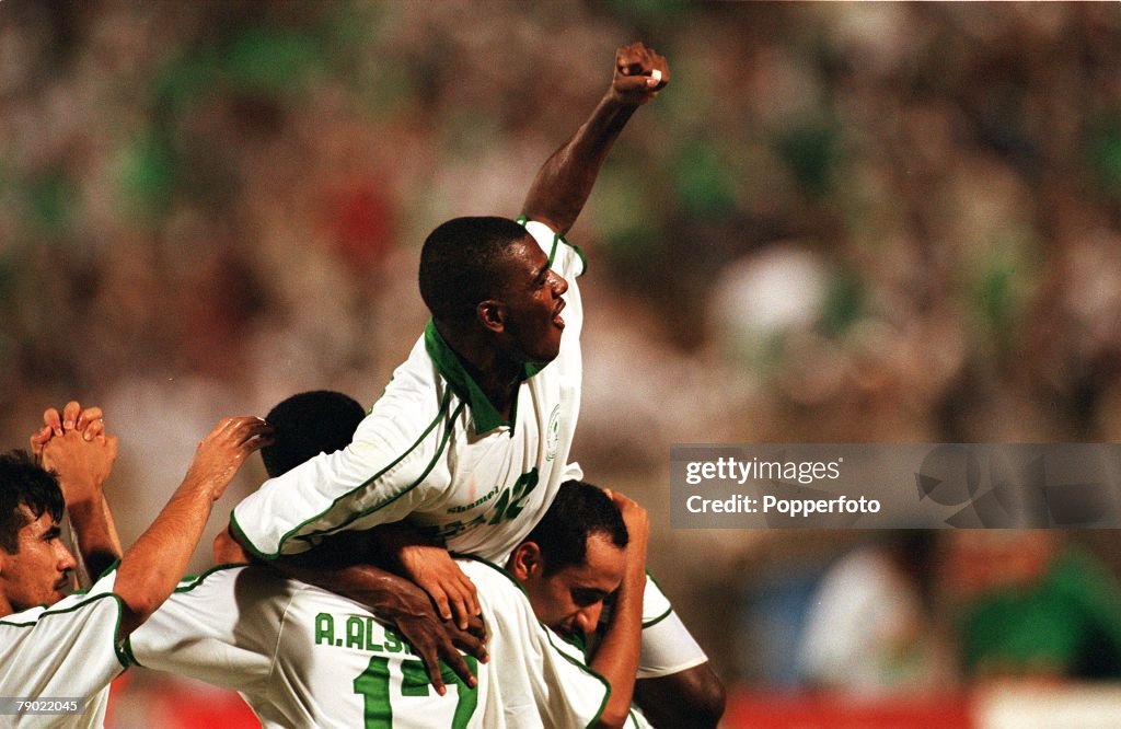 Sport. Football. 2002 World Cup Qualifier. AFC, Second Round, Group A. Jeddah. 28th September 2001. Saudi Arabia 2 v Iran 2. Saudi Arabia's Ahmed Dukhi Al Dossary (12) celebrates with team-mates.