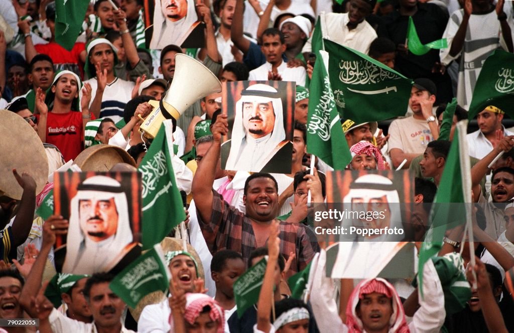 Sport. Football. 2002 World Cup Qualifier. AFC, Second Round, Group A. Jeddah. 28th September 2001. Saudi Arabia 2 v Iran 2. Saudi Arabia fans wave flags and posters.