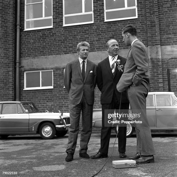 Football, 15th July 1962, Manchester, England, Manchester United Manager Matt Busby and new signing Denis Law are interviwed by a TV Reporter outside...