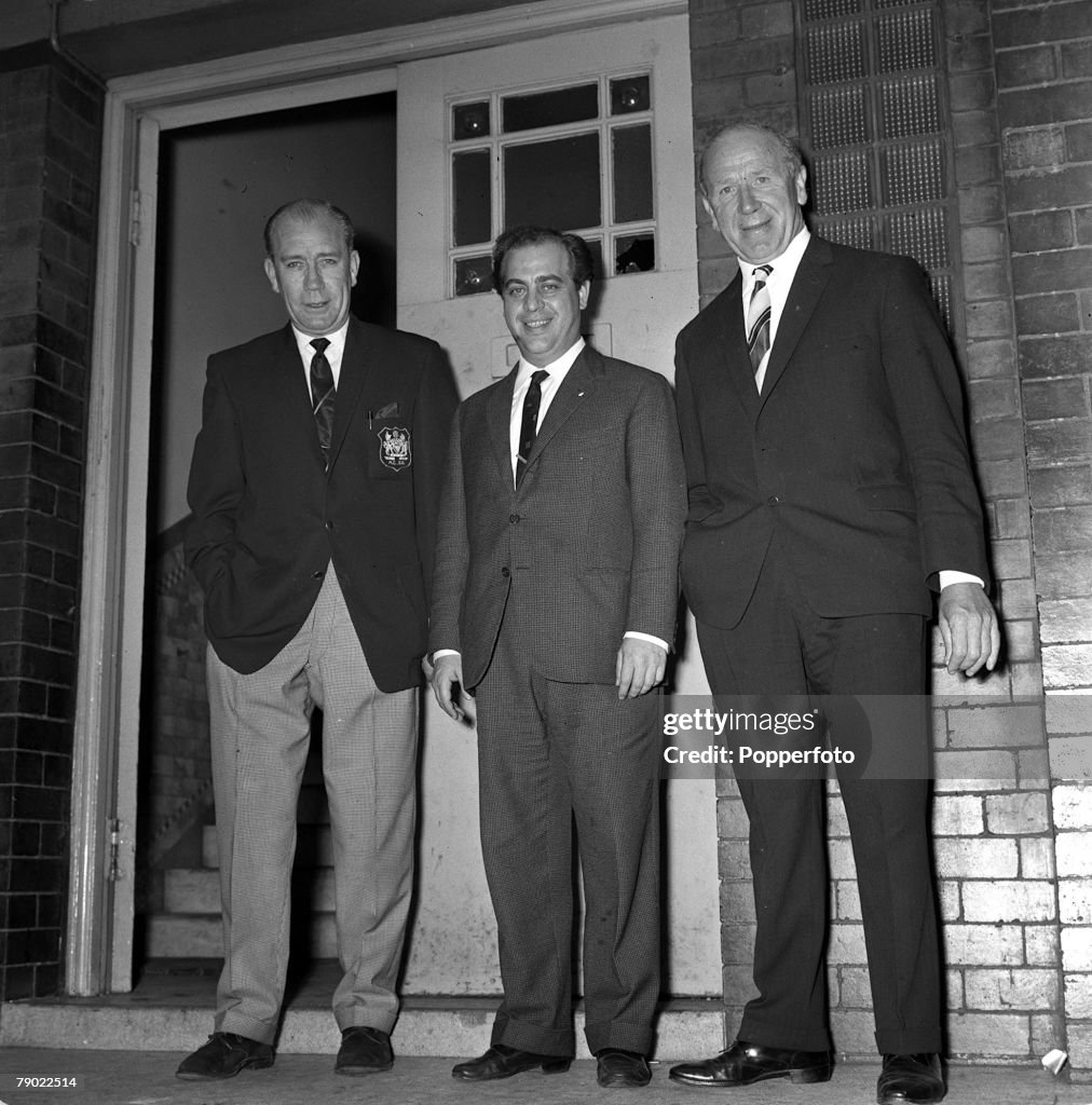 Football. 15th July 1962. Manchester, England. Manchester City Manager Les McDowell, Italian "agent" Gigi Peronace, and Manchester United Manager Matt Busby are pictured after Denis Law signed for United. A cheque for ?40,000 has just been paid to Manches