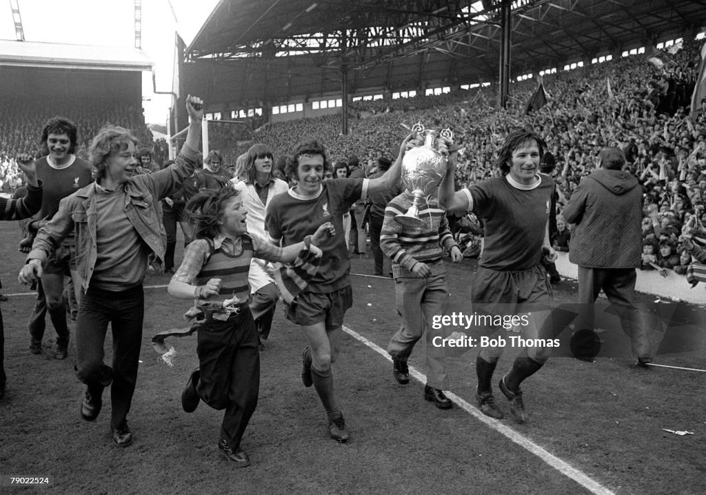 Football. England. League Division One. 28th April 1973. Liverpool 0 v Leicester City 0. Liverpool's Ian Callaghan and Tommy Smith parade the League Championship trophy to fans in the Kop at Anfield as Liverpool become league champions.