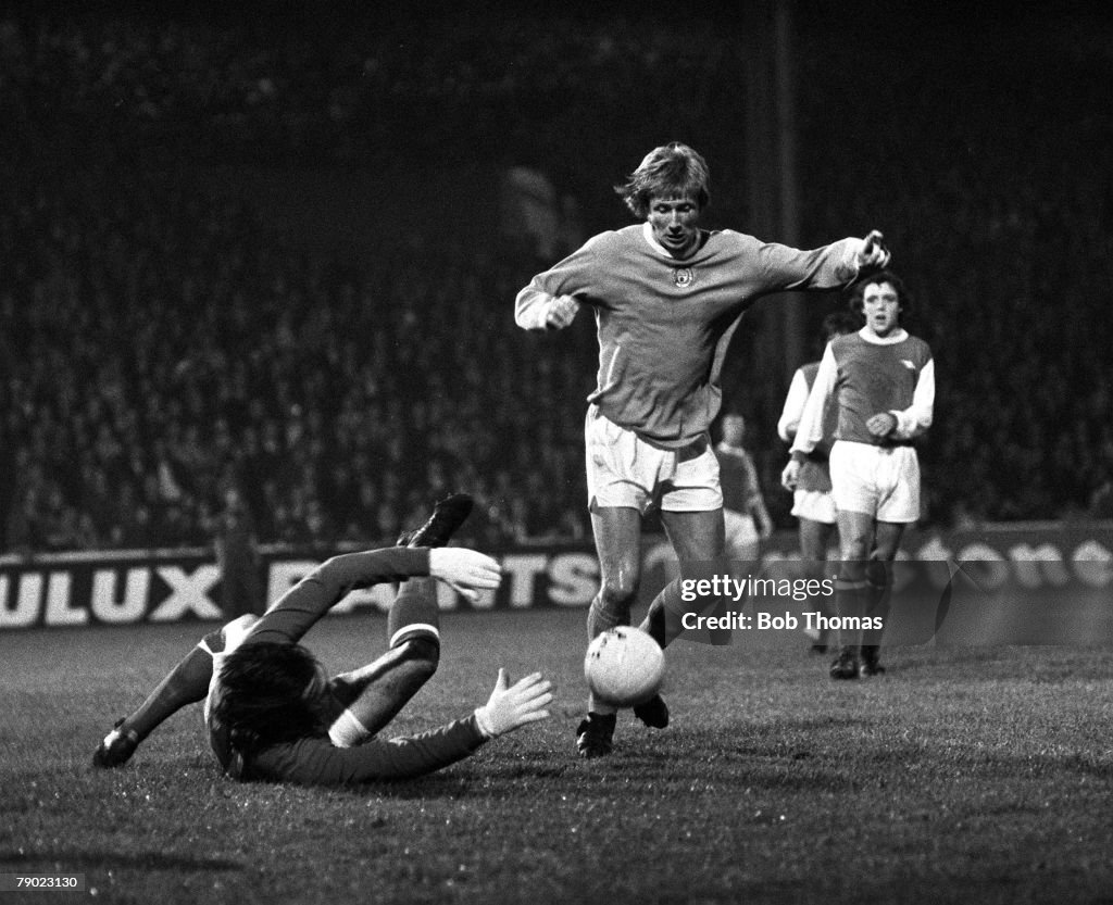 Sport. Football. England. 16th October 1974. League Division One. Manchester City 2 v Arsenal 1. Manchester City's Colin Bell takes the ball around Arsenal goalkeeper Jimmy Rimmer.