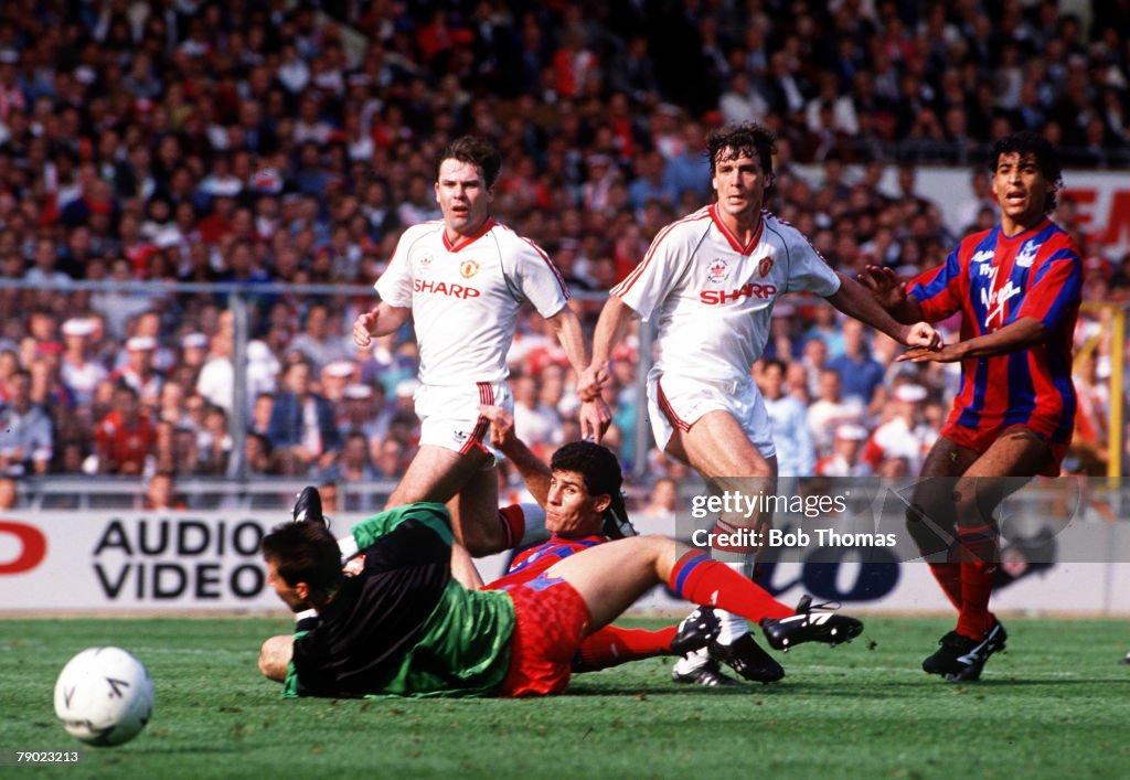 Football. 1990 FA Cup Final. Wembley. 12th May, 1990. Manchester United 3 v Crystal Palace 3. Crystal Palace goalkeeper Nigel Martyn is beaten by Mark Hughes for Manchester United's third goal.