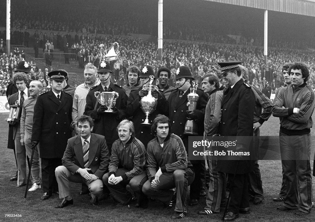Sport. Football. England. 1978. The First Division Champions and League Cup winners Nottingham Forest line up with their trophies, together with members of the local police constabulary who were placed in charge of the cups by Forest Manager Brian Clough 