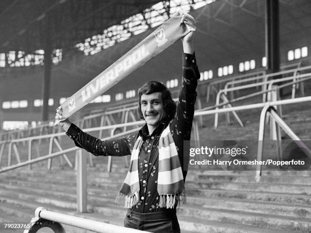 Liverpool footballer Terry McDermott on 'The Kop' terrace at Anfield in Liverpool, England, circa December 1974.