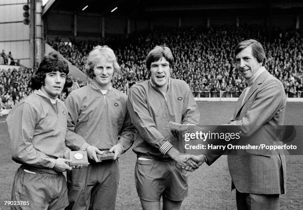 Liverpool FC footballers Kevin Keegan , Alec Lindsay and Emlyn Hughes receive their medals from the FA's Ted Croker during the Rothmans Golden Boots...