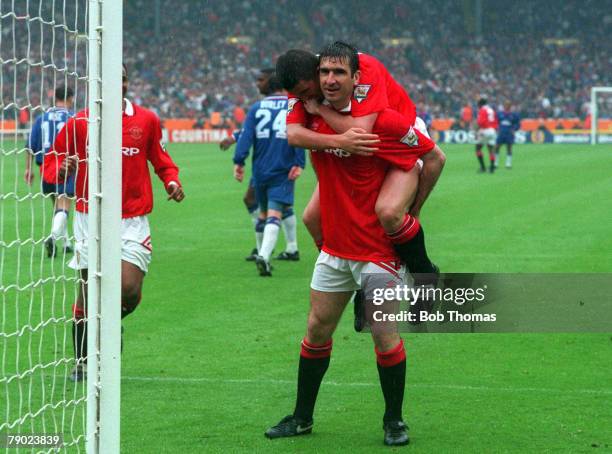 Football, 1994 FA Cup Final, Wembley, 14th May Manchester United 4 v Chelsea 0, Manchester United's Eric Cantona is congratulated by teammates after...