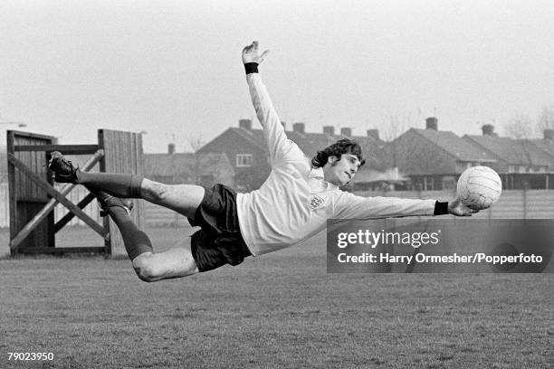 Liverpool and England goalkeeper Ray Clemence making a full length save, wearing his England kit, at Melwood Training Ground in Liverpool, England,...