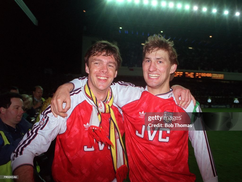 Sport. Football. Highbury, England. League Division One. 6th May 1991. Arsenal 3 v Manchester United 1. Arsenal's David O'Leary (left) and Tony Adams celebrate at the end of the match after their side had won the Championship.