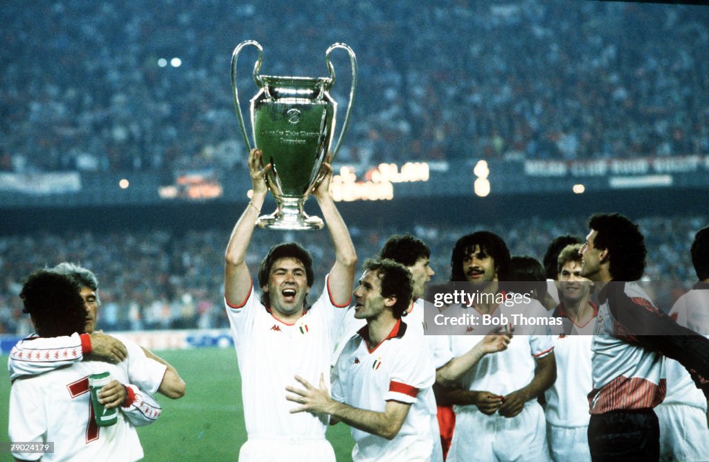 Sport. Football. European Cup Final. Nou Camp, Barcelona, Spain. 24th May 1989. AC Milan 4 v Steaua Bucharest 0. AC Milan's Carlo Ancelotti holds the trophy aloft with his team-mates.