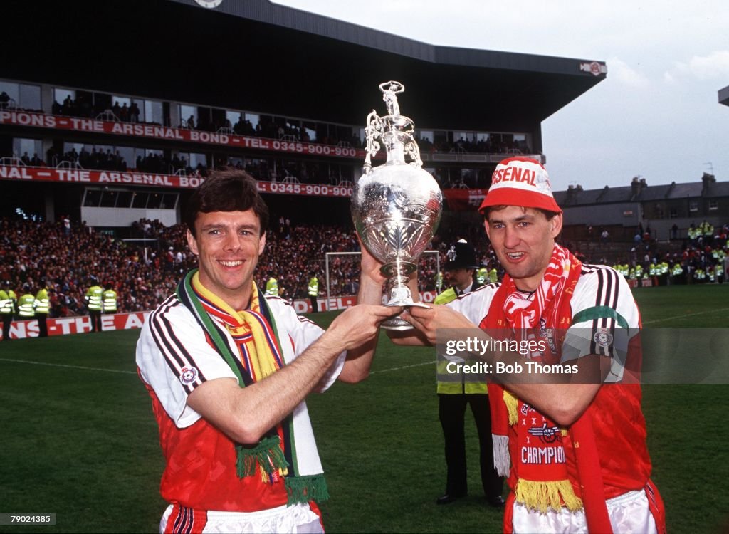 Sport. Football. Highbury, England. League Division One. 11th May 1991. Arsenal 6 v Coventry 1. Arsenal captain Tony Adams (right) and team-mate David O'Leary hold the Championship trophy aloft.