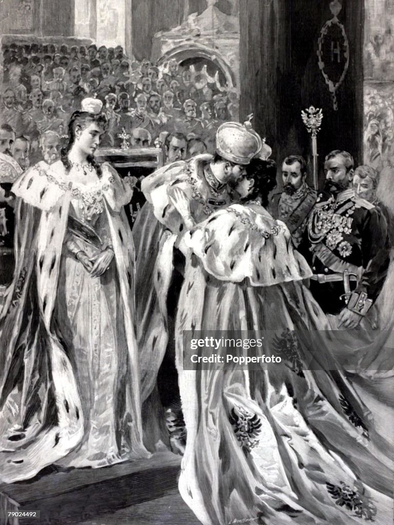 Russian Royalty. Illustration. Moscow, Russia. 14th May 1896. The Coronation of the Tsar of Russia, Nicholas II. The newly crowned Tsar Nicholas II embraces the former Tsarina watched by his wife Tsarina Alexandra Feodorovna.