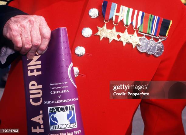 Football, 1997 FA Cup Final, Wembley, 17th May Chelsea 2 v Middlesbrough 0, A Chelsea pensioner in traditional uniform with his medals and FA Cup...