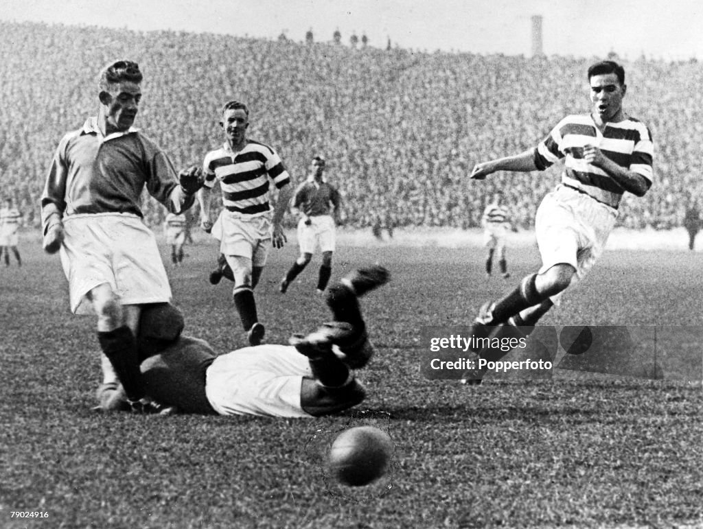 Sport. Football. Celtic Park, Glasgow, Scotland. September 1931. Celtic v Rangers. Celtic goalkeeper Johnny Thomson dives at the feet of Rangers' Sam English in an attempt to stop a goal and in the collision Thomson suffered a fractured skull and died lat