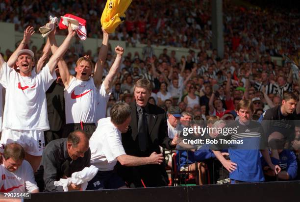 Football, 1998 FA Cup Final, Wembley, 16th May Arsenal 2 v Newcastle United 0, Arsenal manager Arsene Wenger and bench jump for joy as they celebrate...