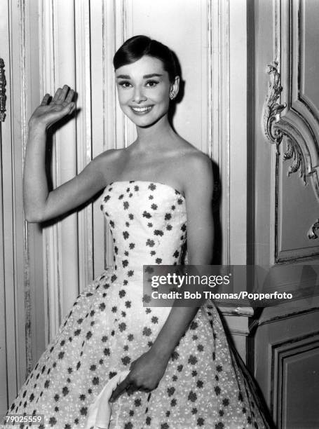 S, Belgian born American film actress Audrey Hepburn waves at the camera