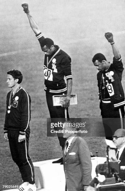 During the award presentation for the Men’s 200 metres event final at the 1968 Summer Olympics, American athletes, gold medalist Tommie Smith and...