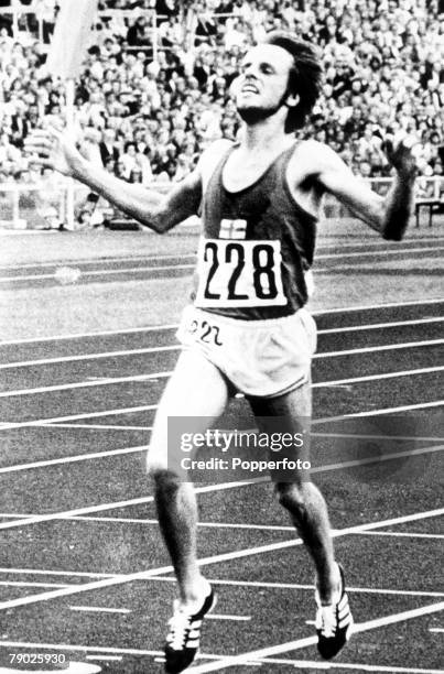 Lasse Viren of Finland crosses the finish line in first place in the final of the Men's 10,000 metres event to take the gold medal in a new world...