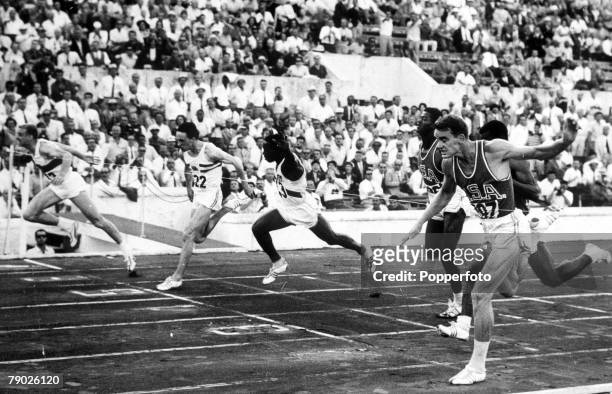 Olympic Games, Rome, Italy, Men's 100 Metres Final, West Germany's Armin Hary crosses the line to take the gold medal ahead of USA's silver medallist...