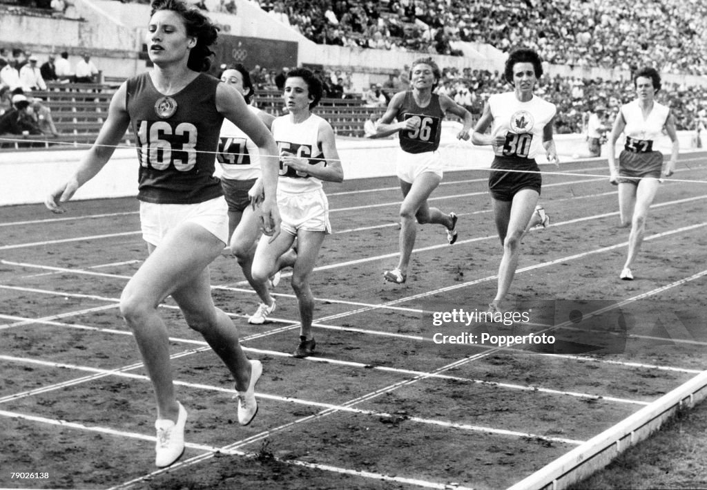 1960 Olympic Games. Rome, Italy. Women's 800 Metres Heat. USSR's eventual gold medal winner Lyudmila Shevtsova crosses the line to win the race ahead of Hungary's Gizella Csoka (56) and Poland's Beata Zbikowska (147).