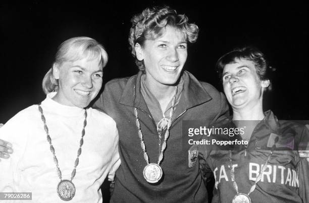 Olympic Games, Rome, Italy, Women's High Jump, Romanian gold medal winner Iolanda Balas wears her medal as she stands with Polish silver medallist...
