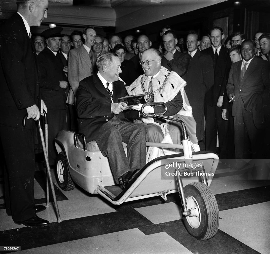 Golf: October 1958. St Andrews, Scotland. Legendary American golfer Bobby Jones is pictured receiving the Freedom of St Andrews, sitting in his special golf buggy.