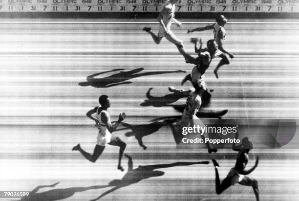 Olympic Games, London, England, Men's 100 Metres Final, Photo-finish, USA's Harrison Dillard about to cross the line to win the gold medal followed...