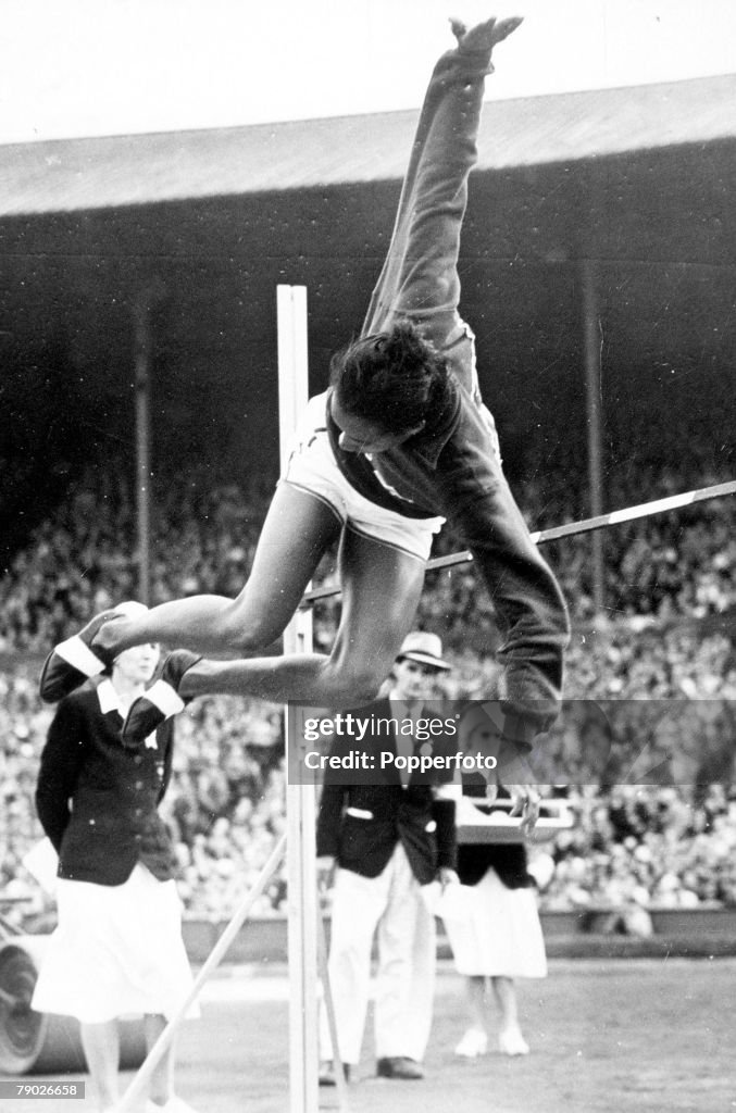 1948 Olympic Games. London, England. Women's High Jump. USA's Alice Coachman in action to win the gold medal with a new Olympic record jump.
