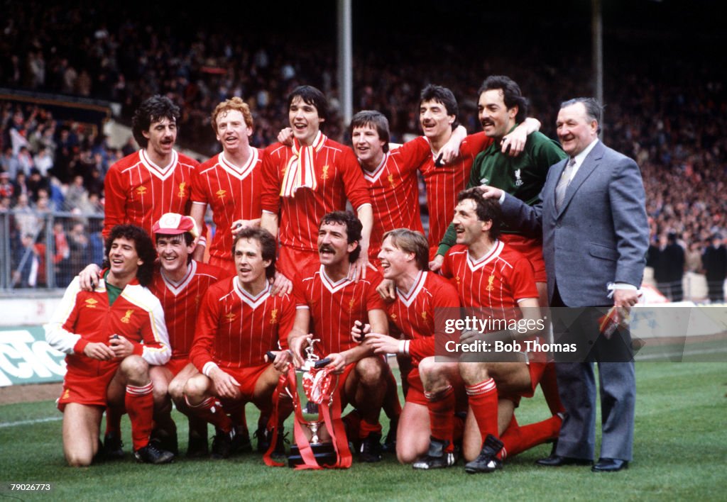 Sport. Football. Milk Cup Final. Wembley, London, England. 26th March 1983. Liverpool 2 v Manchester United 1 (after extra time). The Liverpool team celebrate with the trophy. Back Row L-R: Mark Lawrenson, David Fairclough, Alan Hansen, Ronnie Whelan, Ian