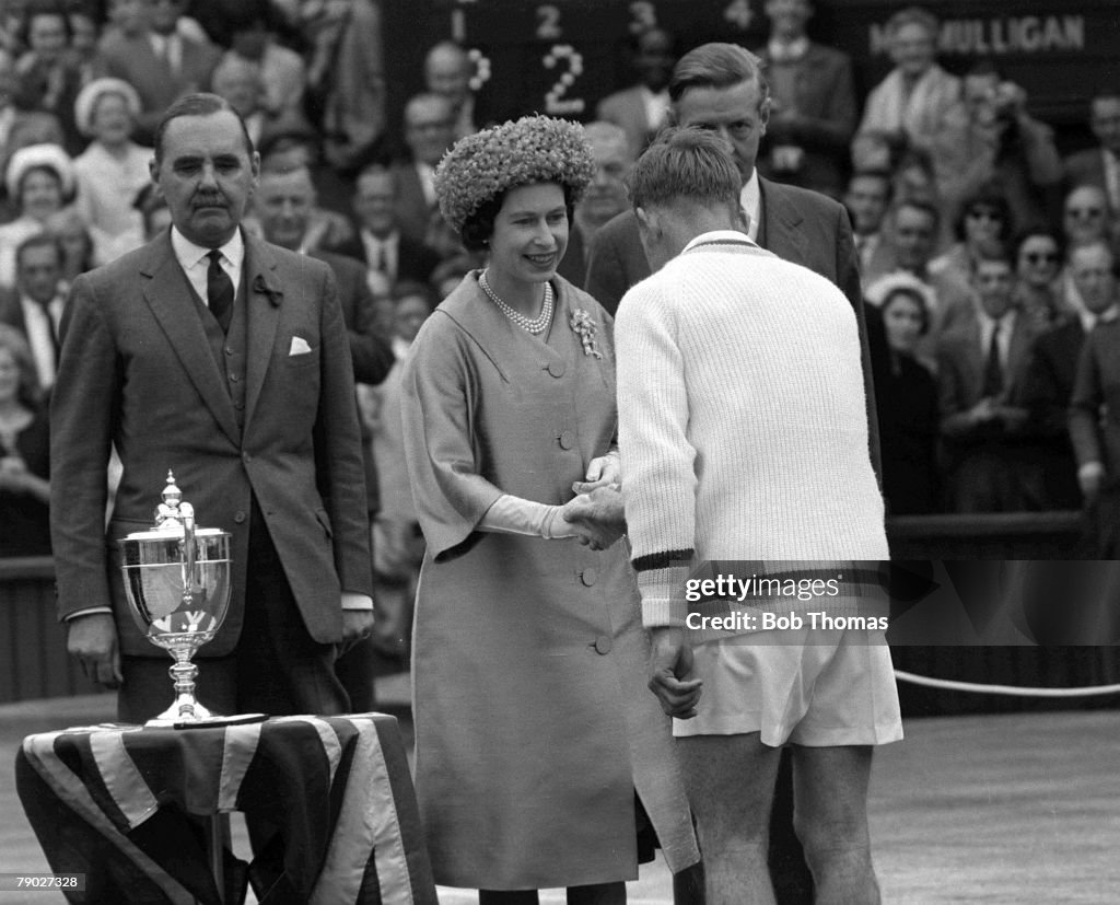 Tennis. 1962 Wimbledon All England Tennis Championships. Men+s Singles. Australia's Rod Laver is congratulated by HRH Queen Elizabeth II before the presentation of the trophy, following his victory over Martin Mulligan.
