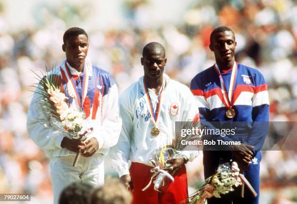 Olympic Games, Seoul, South Korea, Men's 100 Metres Final, Canadian gold medal winner Ben Johnson stands on the podium with USA silver medallist Carl...