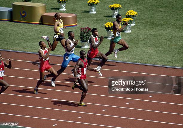 Canadian track athlete Ben Johnson pictured in first place to win the gold medal in the final of the Men's 100 metres event, with Carl Lewis of the...