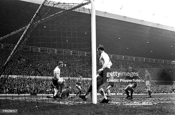 Scottish footballer Denis Law scores Manchester United's third goal against Burnley in a League Division One match at Old Trafford, Manchester, 24th...