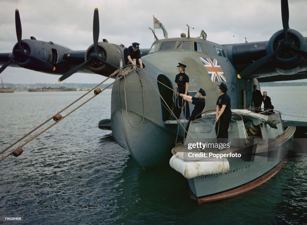 World War Two June 1943: Female Seamen of BOAC moor the Boeing 314a Clipper flying boat +Berwick+.