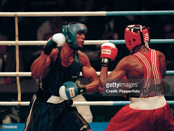 Cuban gold medal winning boxer Felix Savon pictured left in action against silver medal winning Canadian boxer David Defiagbon in the final of the...