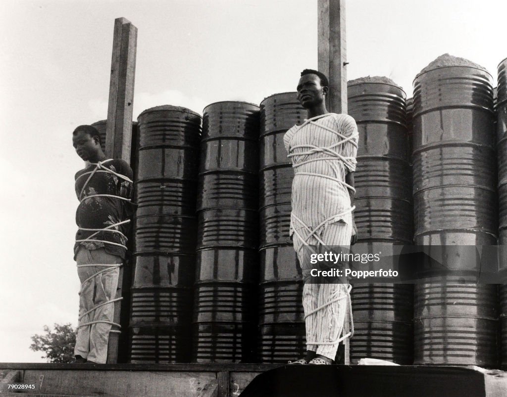 Capital Punishment. Ilorin, Nigeria. 10th June 1971. Two convicted armed robbers about to be executed by firing squad.