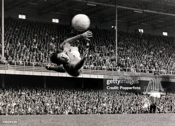 English professional footballer and goalkeeper with Stoke City FC, Gordon Banks pictured diving to save the ball during the League Division One match...