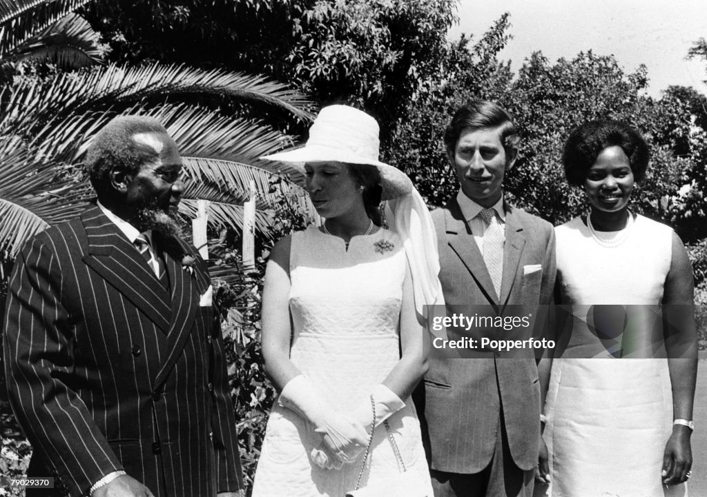 Nairobi, Kenya, Africa. 15th February 1971. Princess Anne chats to President Jomo Kenyatta of Kenya (left) as Prince Charles stands with the President+s wife Ngina.
