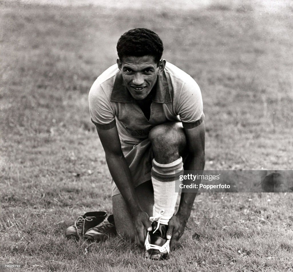 Sport. Football. April 1957. Brazil international Garrincha putting on his boots. He went on to become a double World Cup winner in 1958 and 1962 with Brazil.