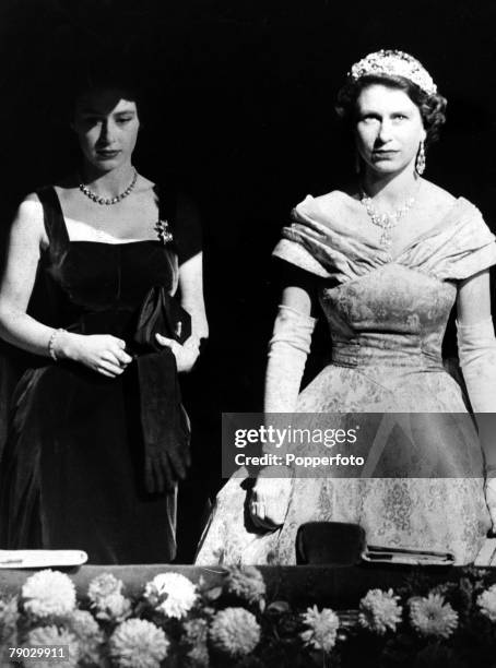 London, England, 3rd November 1952, Queen Elizabeth II and Princess Margaret stand in the Royal Box at the London Palladium where they attended the...