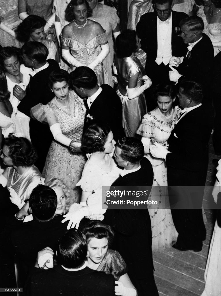 Cape Town, South Africa. 22nd April 1947. Princess Elizabeth and Princess Margaret dance at a Ball in held in honour of Princess Elizabeth+s twenty first birthday, at Government House.