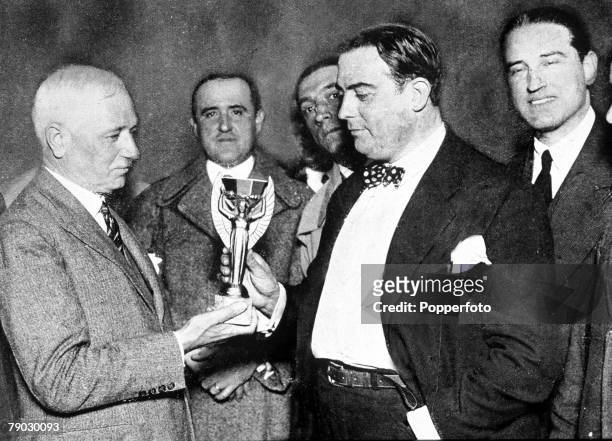World Cup Final Montevideo, Uruguay, Uruguay 4 v Argentina 2, FIFA President Jules Rimet presents the Jules Rimet trophy to Dr, Raul Jude of the...