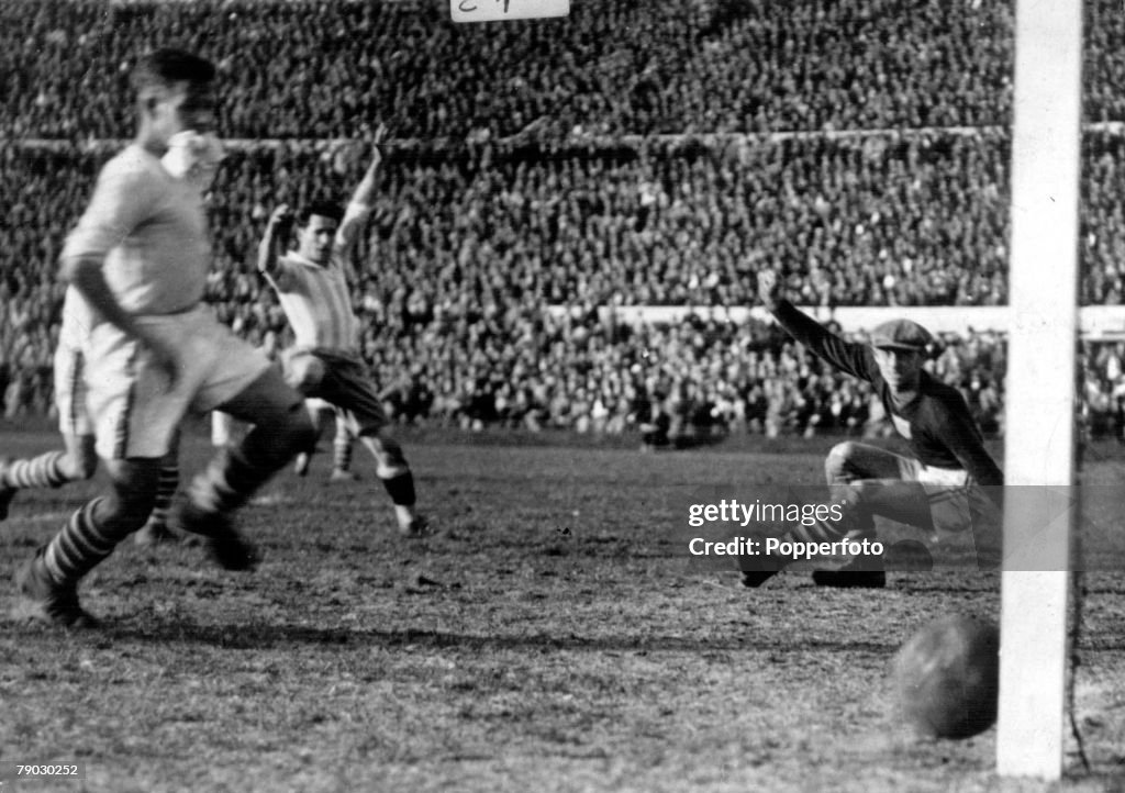 World Cup Semi Final, 1930, Uruguay. Argentina 6 v USA 1. Argentina's Guillermo Stabile beats USA's goalkeeper Jim Douglas to score Argentina's sixth goal in the last minutes.