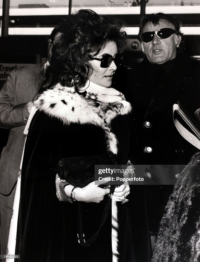 Entertainment/Cinema. London, England. 3rd May 1971. British film actress Elizabeth Taylor pictured with her husband actor Richard Burton leaving Heathrow Airport for Switzerland.