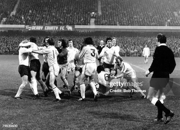 Football, 1st November 1975, Derby County v Leeds United, Both teams get involved in a mass brawl on the halfway line, Leeds United's Norman Hunter...