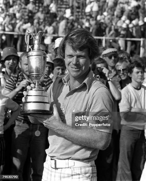 American professional golfer Tom Watson holds the British Open Championship Trophy after finishing in first place to win the 1977 Open Championship...