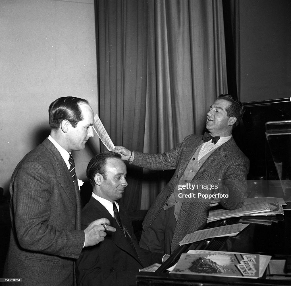 England. 1950. Welsh crooner and musician Donald Peers (right) is pictured with pianist Ernest Ponticelli and musical adviser Walley Ridley.