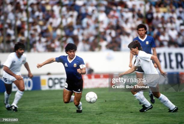 World Cup Finals, Second Phase, Puebla, Mexico, 16th June Argentina 1 v Uruguay 0, Argentina's Diego Maradona battles for the ball with Uruguay's...