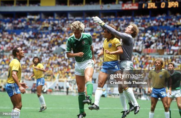 World Cup Finals, Guadalajara, Mexico, 12th June Brazil 3 v Northern Ireland 0, Brazil's goalkeeper Carlos clears the ball with defender Edinho as...