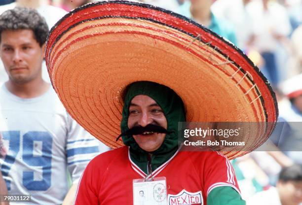 World Cup Finals, Azteca Stadium, Mexico, 7th June Mexico 1 v Paraguay 1, A Mexican fan wearing a huge moustache and sombrero as he watches his team